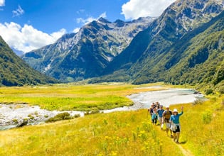 4. Guests walking along the river Siberia Valley