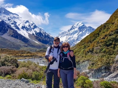 Couple smiling with camera aoraki mt cook cook
