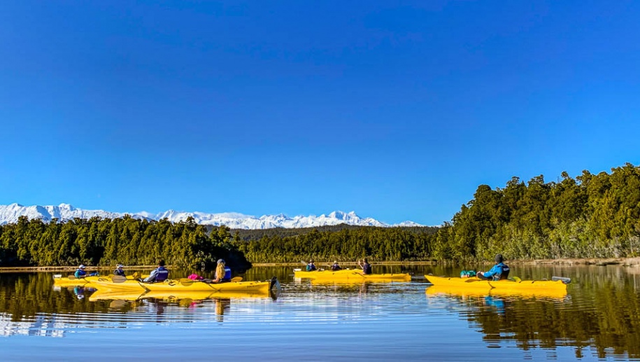Kayaking near the Southern Alps on a New Zealand adventure tour