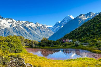 happy guests hiking in Mt Cook National Park Red Tarns