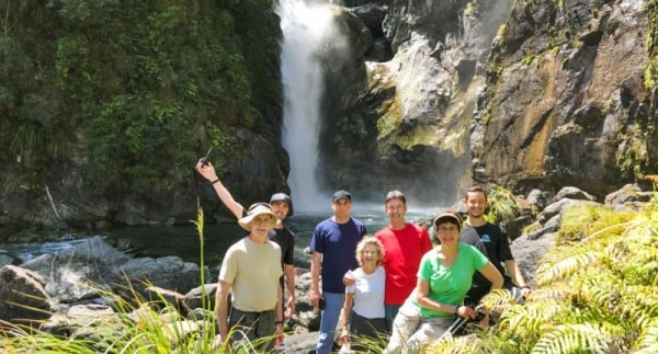Small group walking tours New Zealand at the Hidden Falls on Hollyford Track