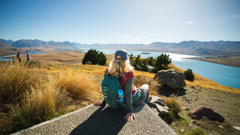 Solo guest looking out over Lake Tekapo