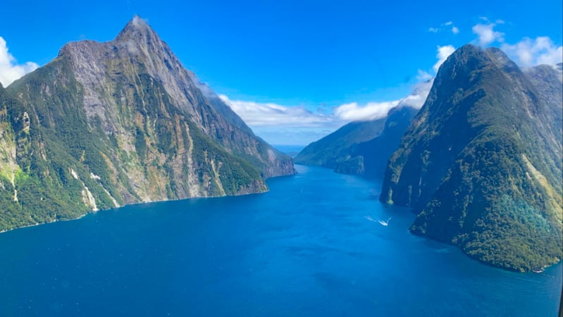 Soar over Milford Sound on your way to the Hollyford Valley.