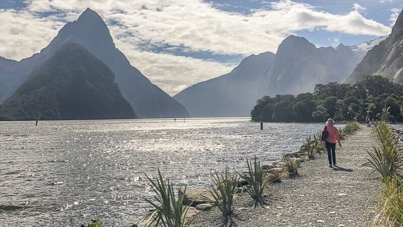 Solo travel tours include walking along Milford Sound, Fiordland