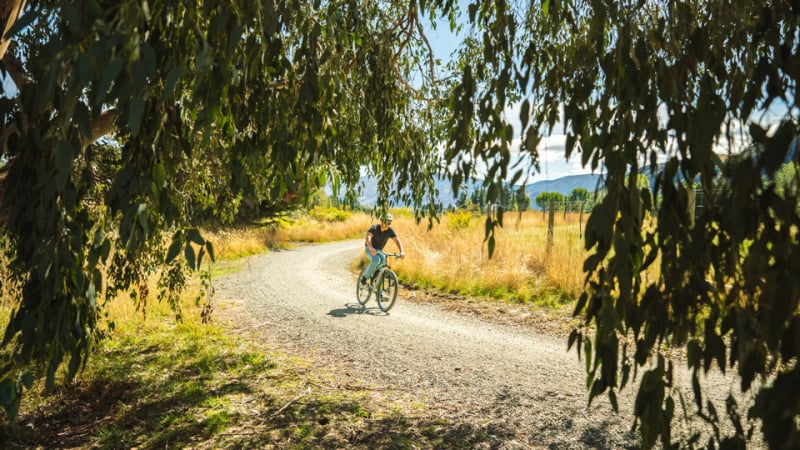 One of our guests bikes along an Arrowtown bike trail