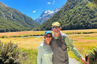 couple hiking the routeburn track mt aspiring national park