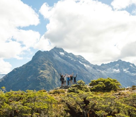 happy guests hiking in Fiordland National Park