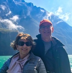 Couple boating through Milford Sound