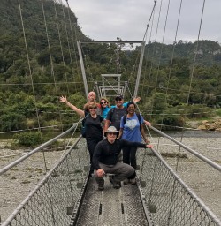 Group on the bridge at Punakaiki river, Paparoa National Park West Coast New Zealand