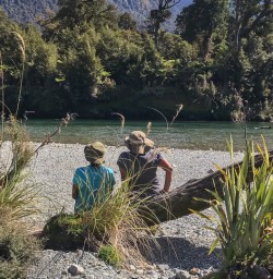 Couple at Hollyford river, Fiordland New Zealand