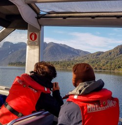 Couple on Jetboat at Lake Mckerrow, Fiordland New Zealand