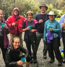 Group having a drink at Hollyford Track, Fiordland National Park Southland New Zealand