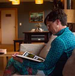 Guest reading in Martins Bay Lodge