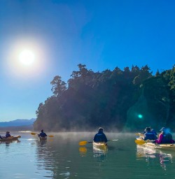 Guests kayaking the Okarito Lagoon