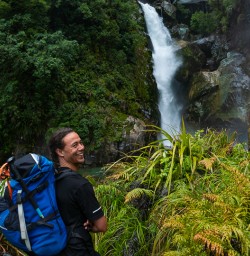 Guide and waterfall Hollyford Track