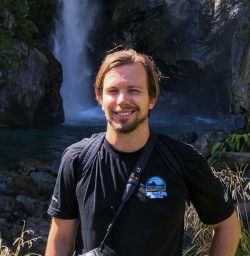 Guide at Hidden Falls, Hollyford Track Fiordland New Zealand