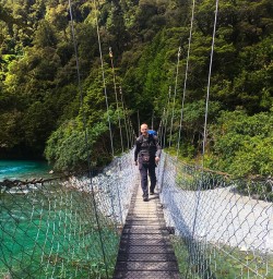 Crossing the gorgeous clear waters of the Hollyford Valley New Zealand