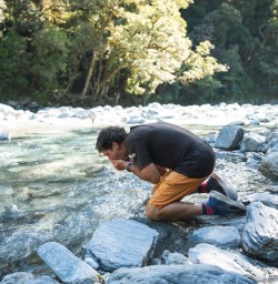 10. Guide Ross drinking from river