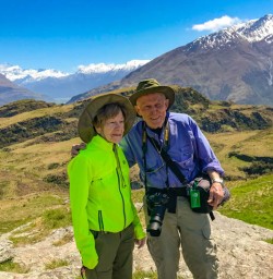 11 Happy guest couple smile for pick atop Rocky Mountain hike