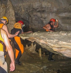 Group exploring Nile River Caves, West Coast New Zealand