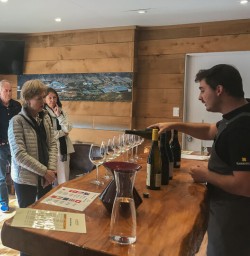 Wine tasting at Kinross wineyard winery, Gibbston Otago New Zealand