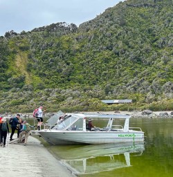Boat to exclusive accomodation in Martins Bay