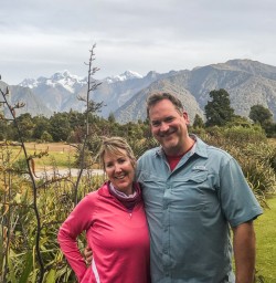 Couple at Lake Matheson walk, West Coast New Zealand