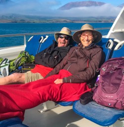 Couple relaxing on Queenstown boat ride