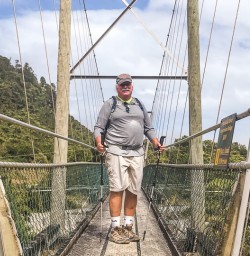 Guest on the bridge at Punakaiki river, Paparoa National Park West Coast New Zealand