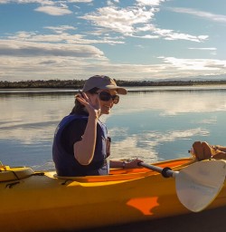 Guest ready to kayak at Okarito Lagoon, West Coast New Zealand