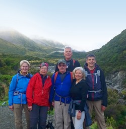 hikers at hooker valley track mount cook