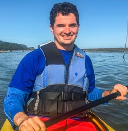 Kayaker at Okarito Lagoon, West Coast New Zealand