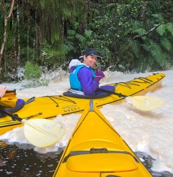 Kayaking in the foam at Okarito Lagoon, West Coast New Zealand