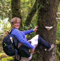 Guest posing with South Island fungi