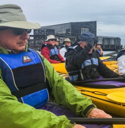 Couple ready to kayak at Okarito lagoon, West Coast New Zealand