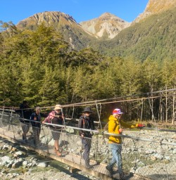 1. Guests crossing bridge Routeburn 
