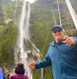 1. Happy guest Milford Sound waterfalls