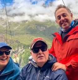 1. Three happy guests on Milford Cruise