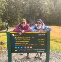 1. Two guests next to Routeburn sign