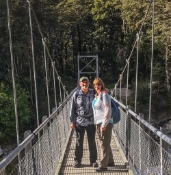 Couple on the bridge at the Routeburn track, Otago New Zealand