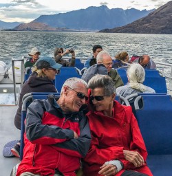 Couple having a cruise on Lake Wakatipu, Otago New Zealand