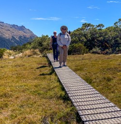 Couple walking the Key Summit, Fiordland New Zealand