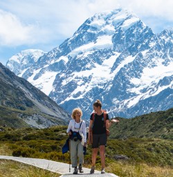 Guest and guide hiking Mount Cook National Park