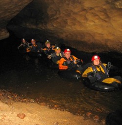 Our team had their own lights in the darkness too! Tubing in the underground river.
