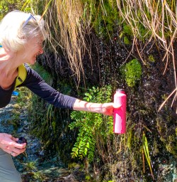 Refilling water on Routeburn Track