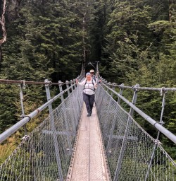 Crossing bridge at Routeburn track, Otago New Zealand