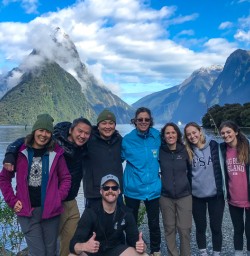 Tour group walking Milford Sound waterfront