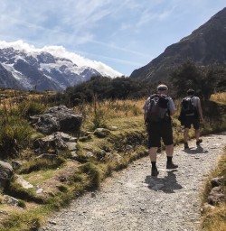 Group walking the Hooker Valley Track, Aoraki Mt Cook Canterbury New Zealand