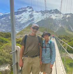 2. Hooker Valley bridge crossing guest couple