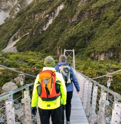 2. Guests walking bridge Hooker Valley